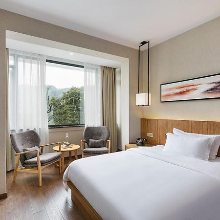 Hangzhou Puyu Travelling With Hotel Bagian luar foto
