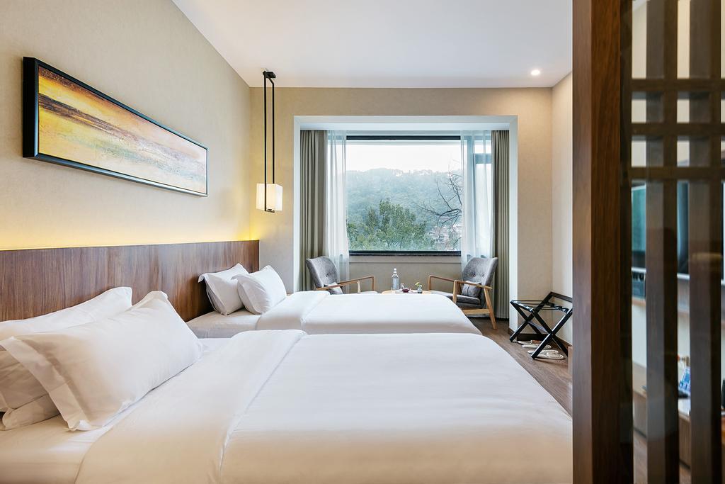 Hangzhou Puyu Travelling With Hotel Bagian luar foto