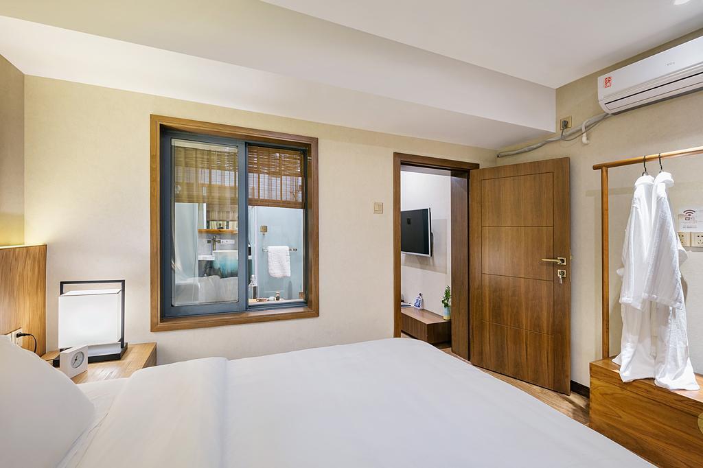 Hangzhou Puyu Travelling With Hotel Bagian luar foto